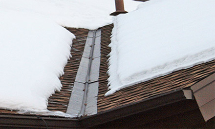 The low-voltage RoofHeat STEP roof de-icing system installed under shingles and in roof valley.