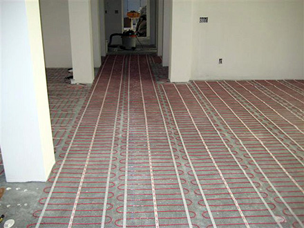 ComfortTile floor heating mats being installed for heated floor.